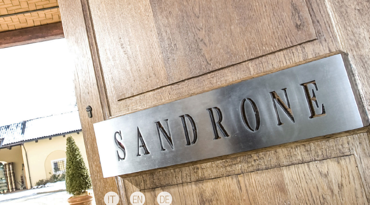 Large wooden door with Sandrone written on it